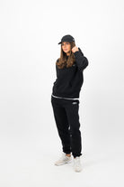 Woman wearing black Concept Padel cap front view