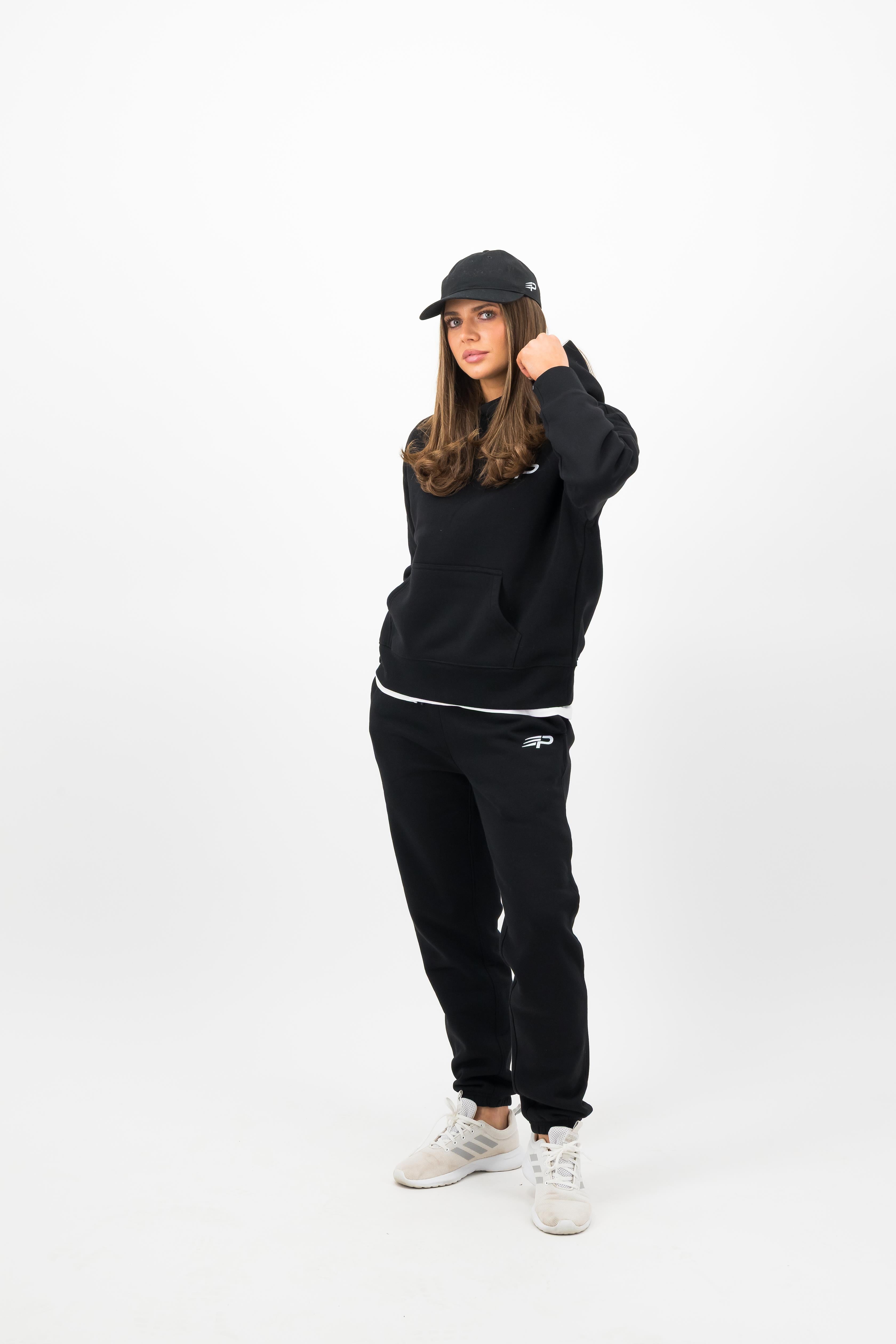 Woman wearing black Concept Padel cap front view