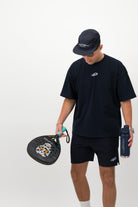 Man wearing navy Concept Padel performance cap front view