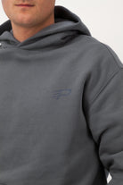 Close‑up of the Concept Padel logo on the shadow rebound hoodie worn against a white background