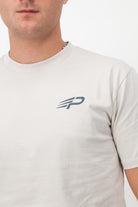 Close‑up of the Concept Padel logo on the bone rebound tee worn against a white background