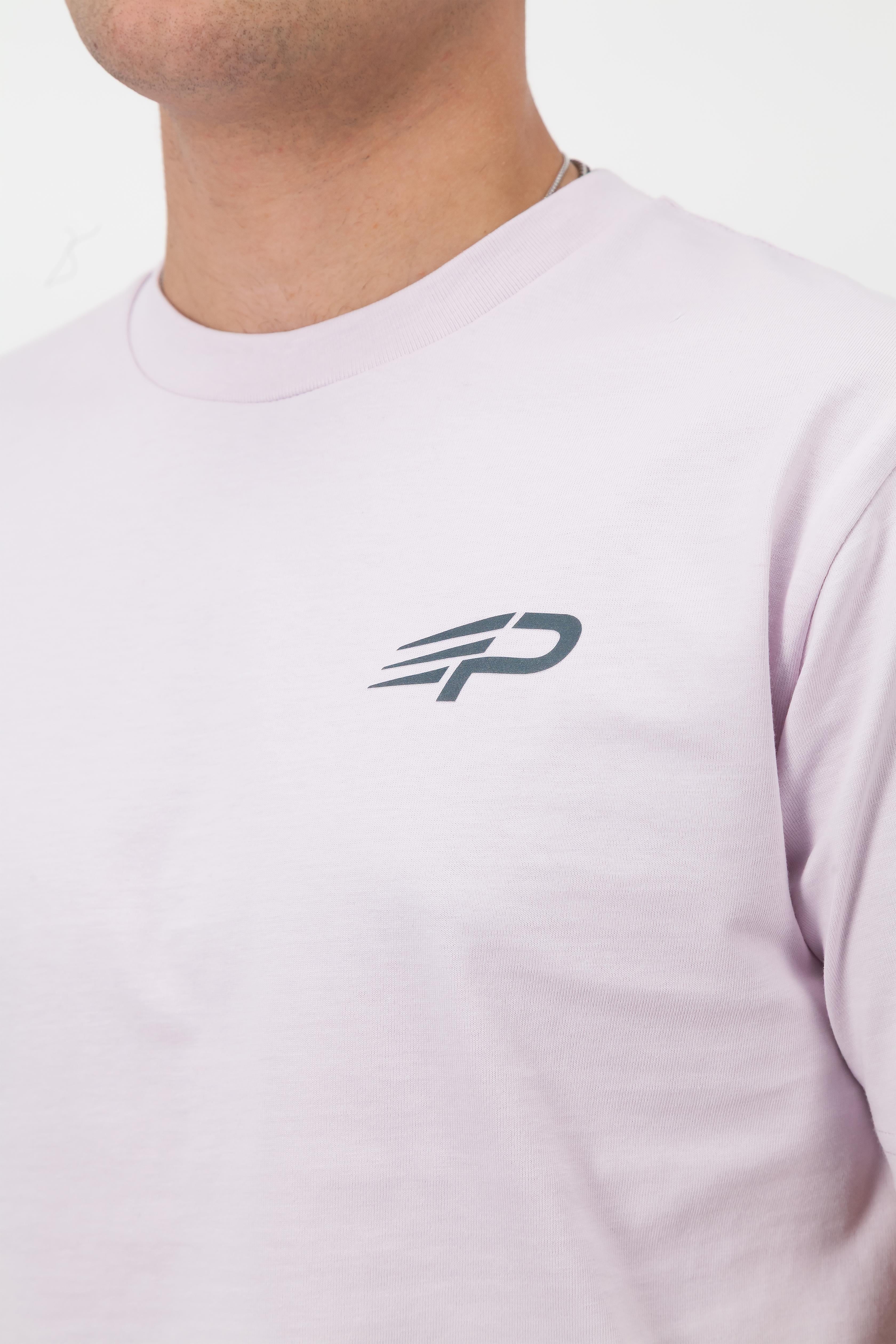 Close‑up of the Concept Padel logo on the orchid rebound tee worn against a white background