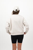 Back view of woman wearing bone Concept Padel cap