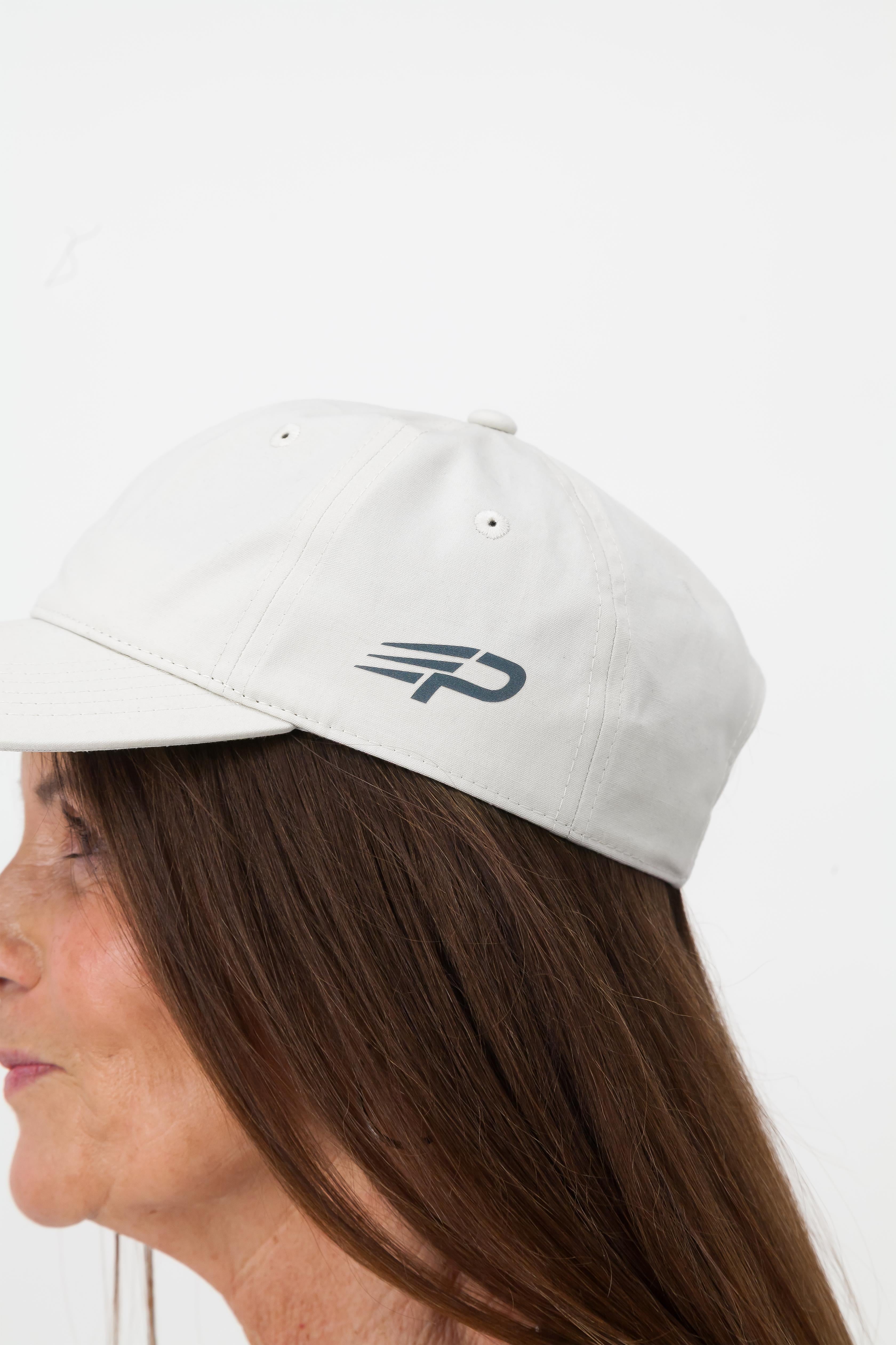 Close up of bone Concept Padel cap with embroidered logo