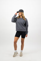 Woman wearing coal Concept Padel cap front view