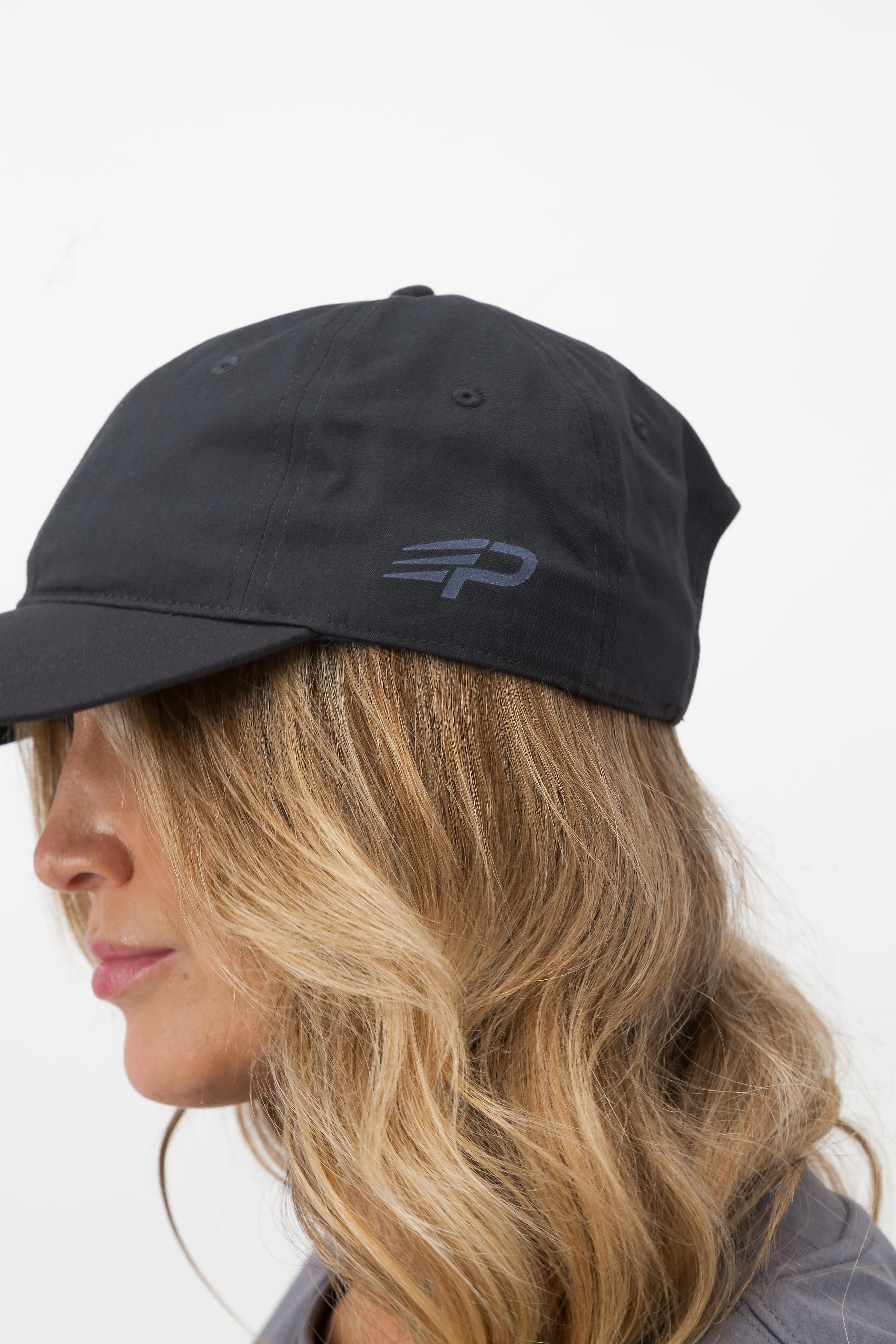 Close up of coal Concept Padel cap with embroidered logo