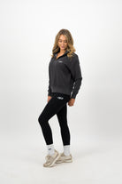 Woman wearing Concept Padel white socks styled with black athletic outfit